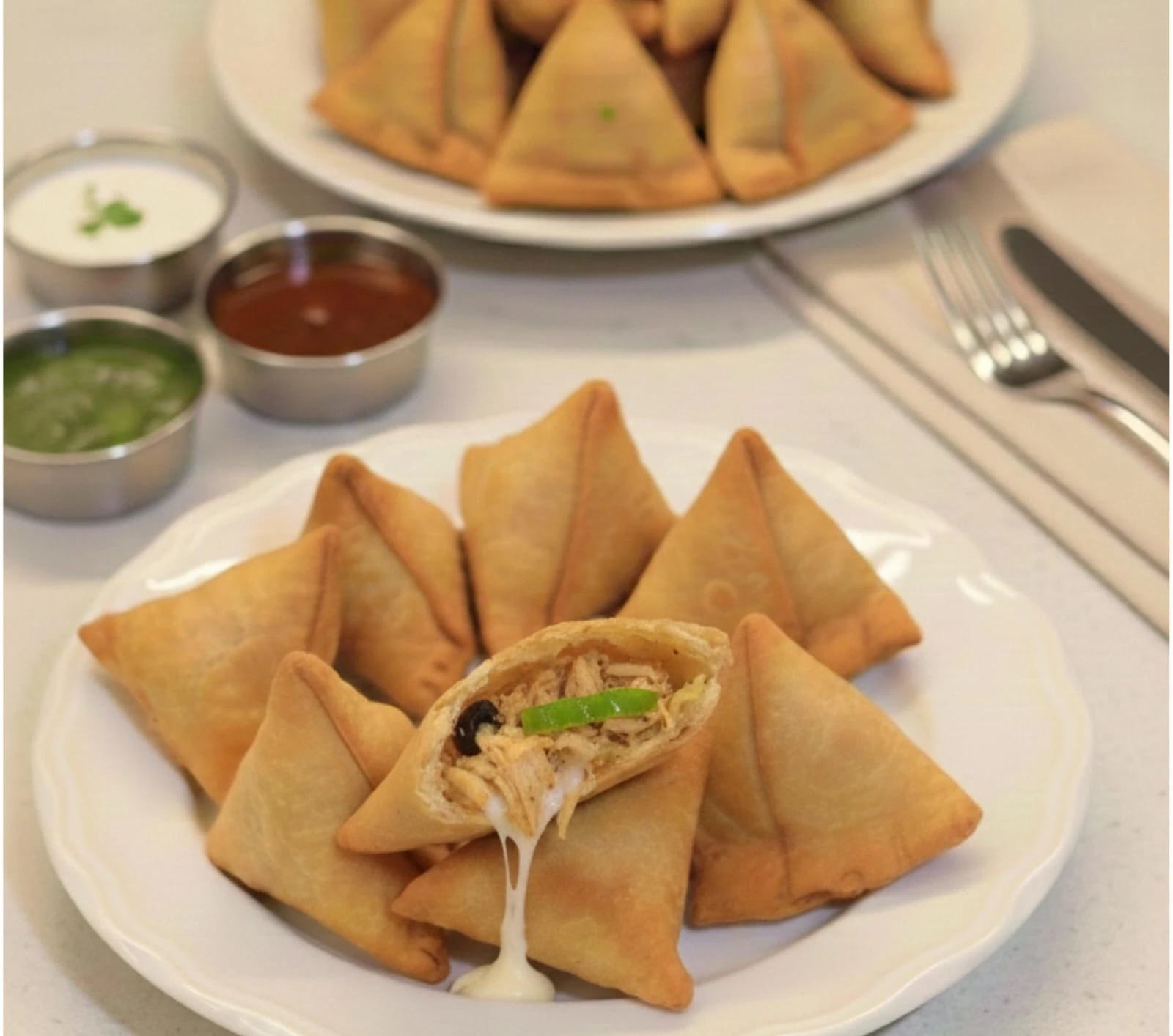 Snap Bite Pizza Samosa Crispy Snap Bite Pizza Samosa with mozzarella cheese, vegetables, and pizza-style herbs – Premium frozen vegetarian fusion snack